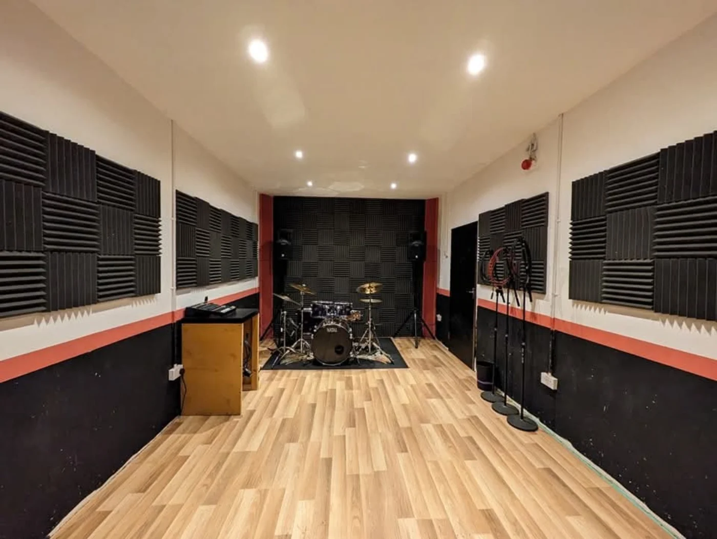 View through a rehearsal room towards the drum kit